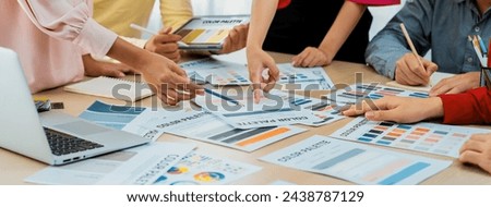 Professional architect designer team brainstorm about color selection while skilled interior design using tablet displayed color palette with color palette document scatter around. Variegated.