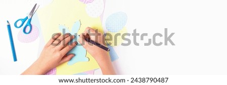 Easter activities. Dot to dot painting bunny game. Line art easter rabbit game for children. Dot to dot drawing activity page. Selective focus. Top view. Banner with copy space. 