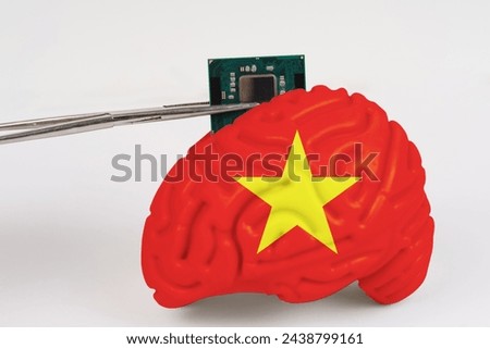 On a white background, a model of the brain with a picture of a flag - Vietnam, a microcircuit, a processor, is implanted into it. Close-up