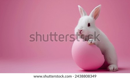 Easter rabbit, cute white bunny coming out of an opened egg on empty pink background with copy space