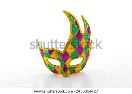 Beautiful multicolor carnival mask on a white background. Purim, Mardi Gras holiday concept. Banner
