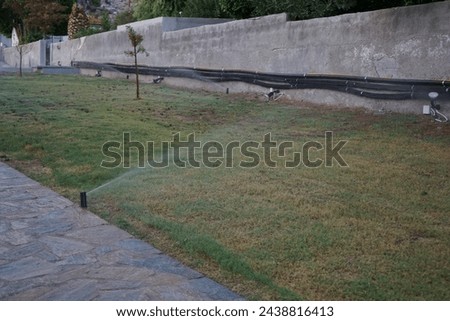 Irrigation system in hot climates. Irrigation, watering, is the practice of applying controlled amounts of water to land to help grow crops, landscape plants, and lawns. Pefki, Rhodes Island, Greece 