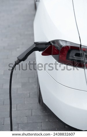 Close up image of the power socket of an electric car, charging.