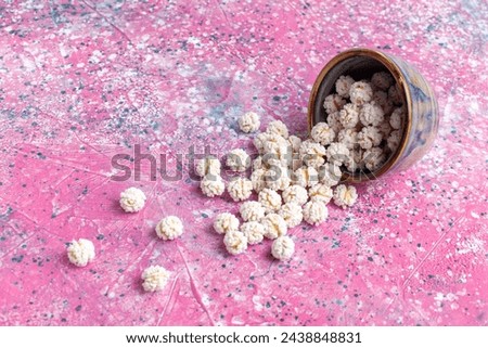 front view white sweet confitures on pink background candy sugar sweet tea color bonbon Royalty-Free Stock Photo #2438848831