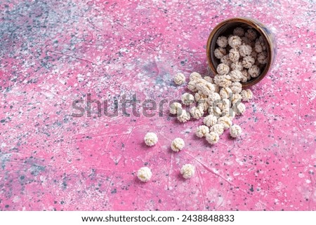 front view white sweet confitures on the pink background candy sugar sweet tea color bonbon Royalty-Free Stock Photo #2438848833