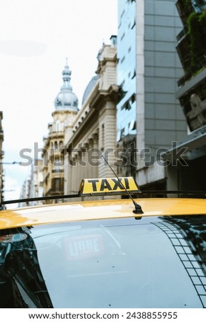 Taxi Sign With Building On The Background. Taxis Of The City Of Rosario. Context Of Insecurity And A Lot Of Fear Due To The Current Drug Violence In The Province Of Santa fe In Argentina.
