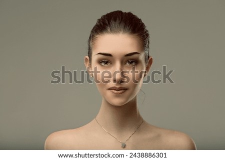 The woman's serene gaze portrays confidence, her calmness an unspoken fortitude Royalty-Free Stock Photo #2438886301