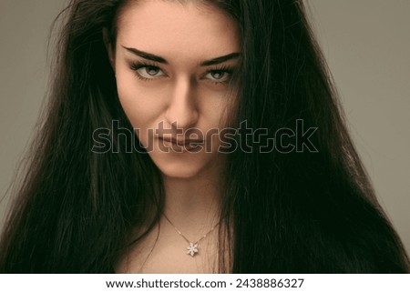 Her gaze, sharp and unwavering, cuts through the superficial, revealing fierce determination Royalty-Free Stock Photo #2438886327