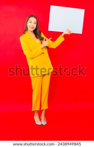 Portrait beautiful young business asian woman smile with empty white billboard for text
