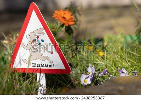 "Egg Alarm" Easter Sign with Rabbit wearing a backpack with Easter Eggs