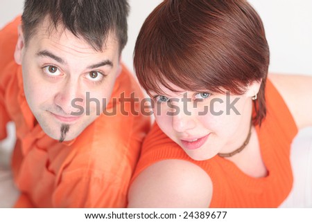 couple in love in orange clothes
