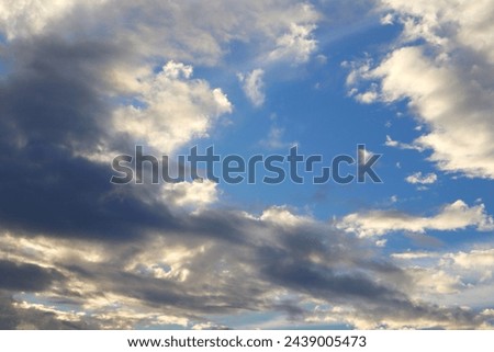 The sun was covered by dark clouds, a sign that rain was coming. Royalty-Free Stock Photo #2439005473