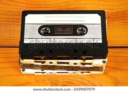 Old Audio Tape Cassettes Set on a Wooden Planks Background closeup