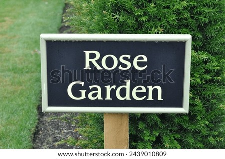 Close Up of Garden Sign 'Rose Garden' 