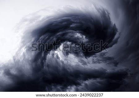 Blurred Whirlwind in the Dramatic Stormy Clouds Royalty-Free Stock Photo #2439022237