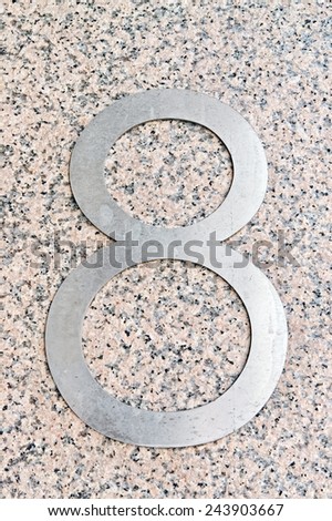 Image of the number 8 on a wall indicating a house number