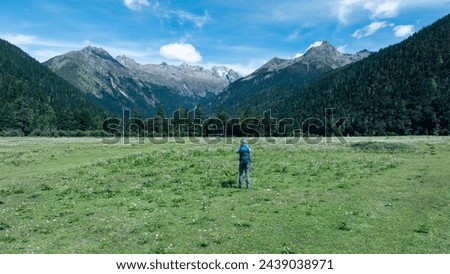 Hiking woman in high altitude mountains