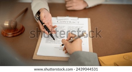 Company hired the lawyer office as a legal advisor and draft the contract so that the client could signs the right contract. Contract of sale was on the table in the lawyer office