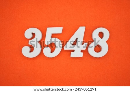 Orange felt is the background. The numbers 3548 are made from white painted wood.