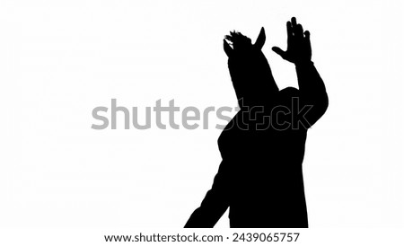 Black silhouette of man in business suit with horse head mask on white isolated studio background. Businessman waving hello. Concept of hard office work.