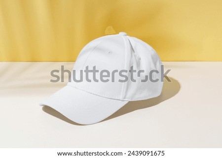 White Baseball Cap on Table