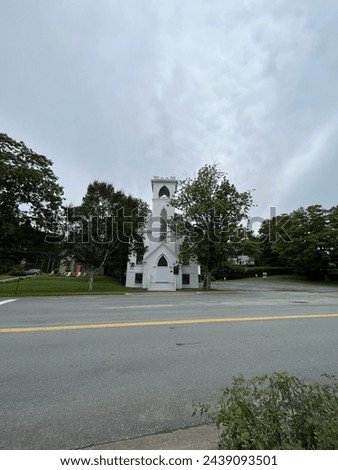 The front exterior of the Trinity United Church in Mahone Bay, NS. Royalty-Free Stock Photo #2439093501