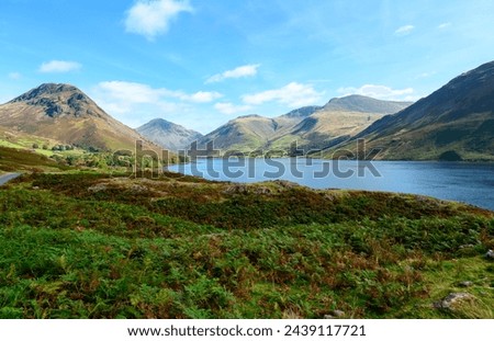 View along Wastwater towards Great Gable, Yewbarrow and Lingmell at the head of the lake. Royalty-Free Stock Photo #2439117721