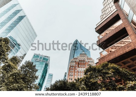 An upward glance at Vancouver's skyscrapers against a clear sky, urban and architectural themes.