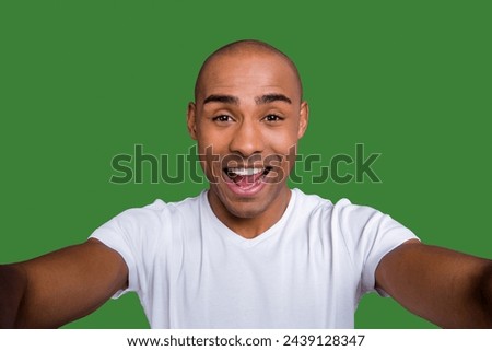 Close up photo funky dark skin he him his macho short hairdo make take selfies video call glad opened mouth cool see relatives friends wearing white t-shirt outfit clothes isolated grey background