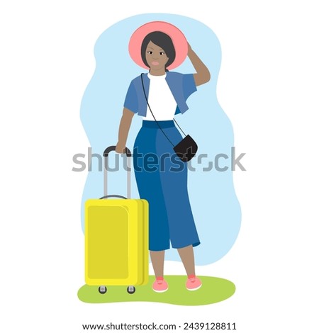 Young girl in a hat on vacation. Cute girl holding a travel suitcase.