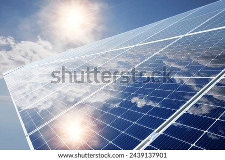 Photo collage of sunset and solar panel, photovoltaic, alternative electricity source - concept of sustainable resources