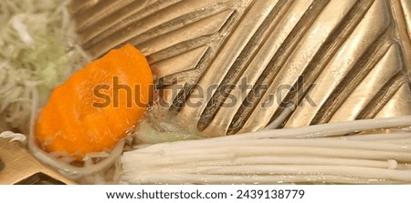 Cook food in a brass pan. Royalty-Free Stock Photo #2439138779