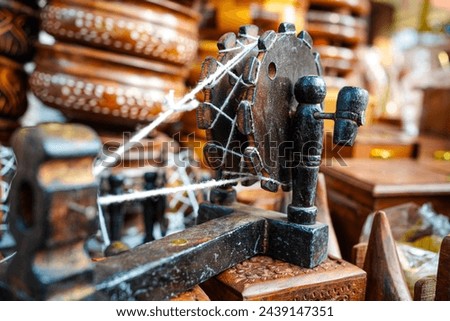 Vintage spinning wheel or charkha in hindi . This is a famous artifact that was used by Gandhiji Royalty-Free Stock Photo #2439147351