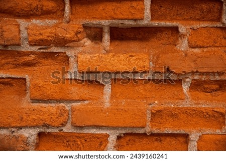 The brick wall has worn away over time. Royalty-Free Stock Photo #2439160241