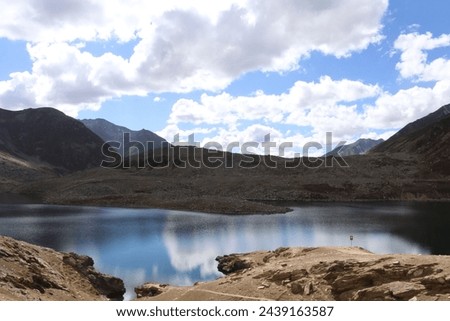 LULLU SAR LAKE THE BLUE AND CRISTAL WATER OF LAKE HAVE A PURITY  ITS BEAUTY ALWAYS ATTRECTS THE VISTERS  Royalty-Free Stock Photo #2439163587