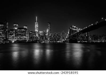 The Manhattan skyline and Brooklyn Bridge at night seen from Brooklyn Bridge Park in Brooklyn, New York.
