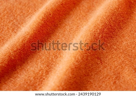 orange color towel texture background. closeup picture. towel sea waves photos.