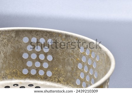 A close up of a metal strainer 