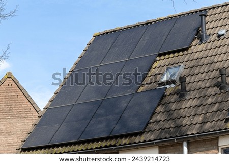 Utrecht, the Netherlands. 14 March 2024. Dirty solar panels on a family house integrated on the roof. View of solar panels with dirt (solar cell) on the roof of a house.
