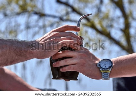 Argentinian breakfast outdoors with mate and bills Royalty-Free Stock Photo #2439232365