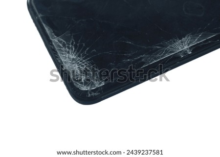 Close-up view of cracked smartphone cellphone screen isolated on white background