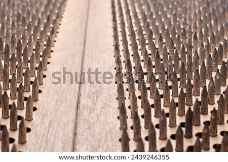 Sadhu board isolated on white background. Practice standing on nails. Nails close up