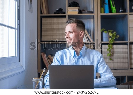 Caucasian reflexive looking at laptop screen, reflexing on work, businessman independent working in a difficult project. Male person preparing at home in the office indoor. Royalty-Free Stock Photo #2439262691
