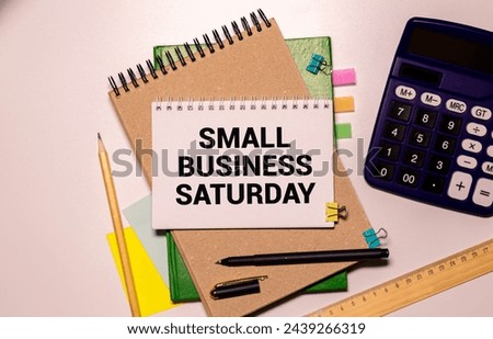 Small Business Saturday - shopping holiday held during the Saturday after Thanksgiving, one of the busiest shopping periods of the year, text concept on notepad