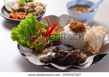 Sambal Iga Bakar or grilled ribs rice with spicy sauce erved in white plate