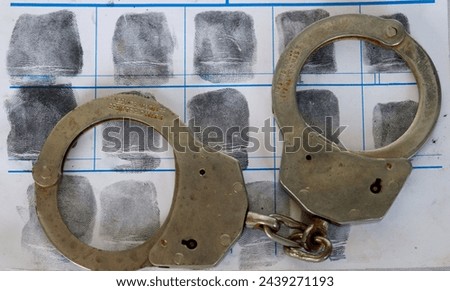 A felony is a serious crime typically punishable by imprisonment for more than one year. It often involves violence or significant harm to society. Royalty-Free Stock Photo #2439271193