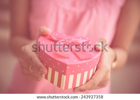 Woman hands holding a gift