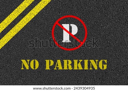 No parking sign and words no parking painted on road.