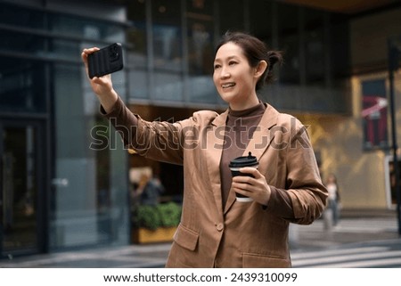 Businesswoman Enjoying Coffee Break with Selfie