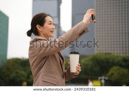 Businesswoman Enjoying Coffee Break with a Selfie